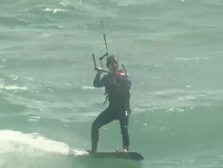 Kite surfers approach the English coastline Stock Footage