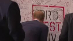 Prince Harry and Elton John signing wall News Clip