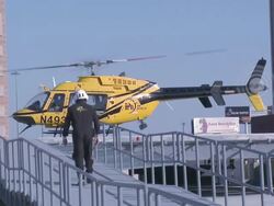 Caucasian doctor boarding helicopter Stock Footage