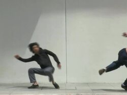 WS SLOMO Two young men doing spinning jump and rolling and laughing  in street, Parkour/Singapore Stock Footage