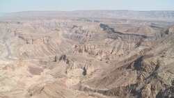 A high mesa overlooks the vast Fish River Canyon in Namibia. Stock Footage