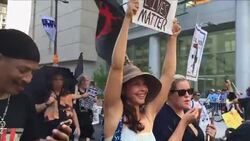 Actress carries a Black Lives Matter sign at protest outside Democratic National Convention Instructional Video