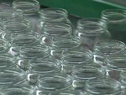 Glass jar on conveyor line Stock Footage
