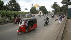 Busy City life in Ella, Srilanka, with mosque in background Stock Footage