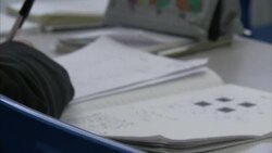 Secondary school pupils doing fractions News Clip