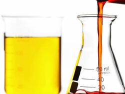 Pouring red liquid into Beaker Stock Footage