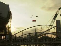 MS Helicopter flying Singaporean flag / Singapore Stock Footage