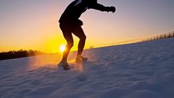 SLO MO Athlete Training In Snow At Sunset Stock Footage