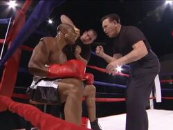 LA MS ZI CU Trainer giving pep talk to boxer in ring while another man wipes his face and pours water over his head / Jacksonville, Florida, USA Stock Footage