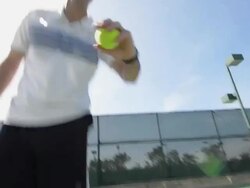 LA WS POV of a man bouncing and and getting ready to serve a tennis ball. Stock Footage