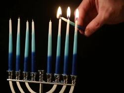 Lighting the menorah Stock Footage