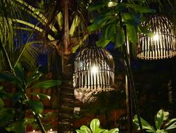 MS Shot of Bamboo lanterns in tropical garden at night / Ko Kradan, Trang, Thailand Stock Footage