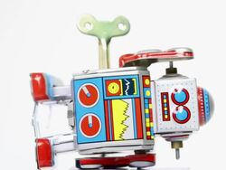 Falling tin toy robots with key Stock Footage