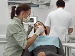 HD DOLLY: Dentist Examining Patient's Teeth Stock Footage