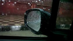 Car moving forward during rainy season Stock Footage