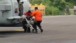 Helicopter unloads what appears to be seats from lost flight; more bodies returned News Clip