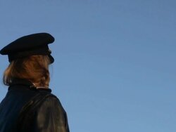 M/S female airline pilot, airplane passes overhead: United Express Bombardier-CRJ Stock Footage