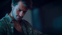 Man in motorcycle workshop building a bike Stock Footage