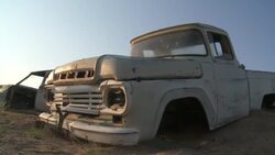 An abandoned truck sits in the Namib Desert. Stock Footage