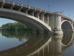 MS Reflection of bridge in river water / Minneapolis, Minnesota, United States  Stock Footage