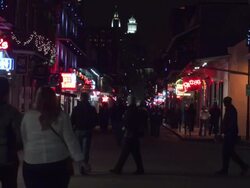 Bourbon Street neon and  nightlife foot traffic in New Orleans Stock Footage