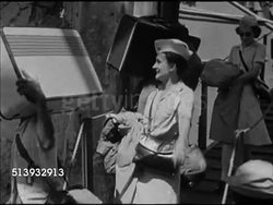 1946: RED CROSS: THE PHILIPPINES:  VS American Red Cross female workers walking down ramp from ship, carrying luggage, boarding trucks. VS Red Cross tent amidst ruined city BG. Post-War, post-World War II, post-WWII , recovery, aid Instructional Video
