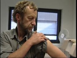 People queue to receive flu vaccinations News Clip