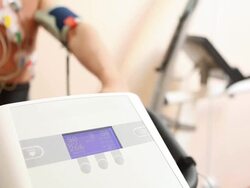 Medicine. ECG pads on a model exercising with bicycle. Stock Footage