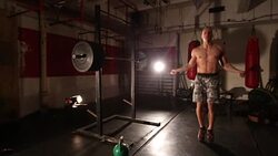 Bodybuilder exercising with a rope Stock Footage