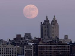 Shot of the moon rising over the San Remo Apartments on the Manhattan Skyline Stock Footage