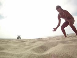 WS TS SLO MO  Woman diving for hitting  beach volleyball / Redondo Beach, California, United States Stock Footage