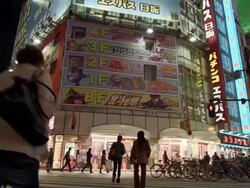 MS PAN LA Shot of Pedestrian with game showrooms / shinjuku, Tokyo, Japan Stock Footage