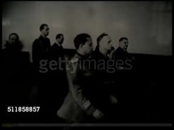 1940: TRIPARTITE PACT: PAN Crowd waving Nazi swastika flags w/ two German police shako helmets FG, TRACKING Count Galeazzo Ciano of Italy, German Foreign Minister Joachim von Ribbentrop, Japanese Ambassador Saburo Kurusu & others, Hitler arriving. Instructional Video