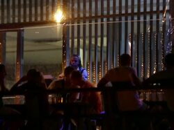 Tourists drinking at a Koh Tao beachfront bar News Clip