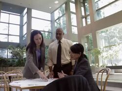 PAN Business associates looking at documents on a small lobby table / Seattle Washington, United States Stock Footage