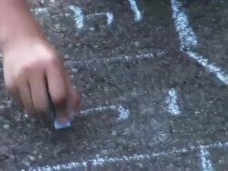 CU Girls hand drawing hopscotch with blue chalk on sidewalk / Langley, British Columbia, Canada.     Stock Footage