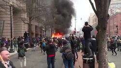 Blazing limousine during anti Trump protest News Clip