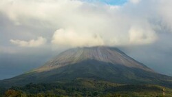 T/L Clouds forming over the Arenal volcano Stock Footage