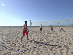 Men playing beach volleyball. Stock Footage
