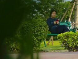 Dolly Shot:Girl play smart phone Stock Footage