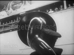 1952: KOREAN WAR: USS GENERAL WILLIAM O. DARBY:  VS Steam expelling from ship funnel (smokestack, chimney), band on dock playing (SOT), U.S. Navy transport ship, 'General William O. Darby' moving away from dock, people waving goodbye, tugboats. Instructional Video