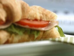 HD: Business Newspaper And Croissant Sandwich Stock Footage