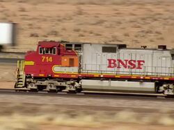 MS AERIAL TS Shot of Railroad and old Route 66 going out of Winslow / Arizona, United States Stock Footage