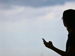 man using smartphone to check weather or flight Stock Footage