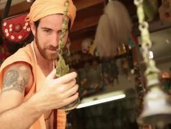 Sage ringing bells at market, Rishikesh, Uttarakhand, India Stock Footage