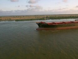 AERIAL WS DS Cargo ship flowing on mississippi river / New Orleans, Louisiana, United States Stock Footage