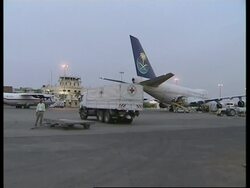 ICRC aid trucks leave for Darfur plus Jesse Jackson comment News Clip