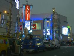 T/L, MS, TV vans parked in front of L.A. Live during grand opening, night, Los Angeles, California, USA Stock Footage