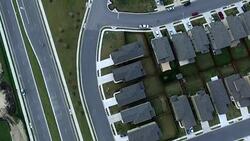 Aerial Straight Down View Neighborhood Housing Community Round Rock near Austin , Texas Suburbia Streets houses roads yards streets to houses Stock Footage