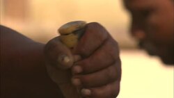 A boat builder hammers an awl. Stock Footage